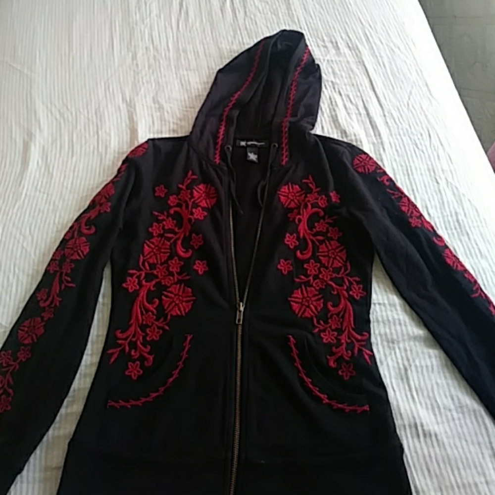a black hoodie with red